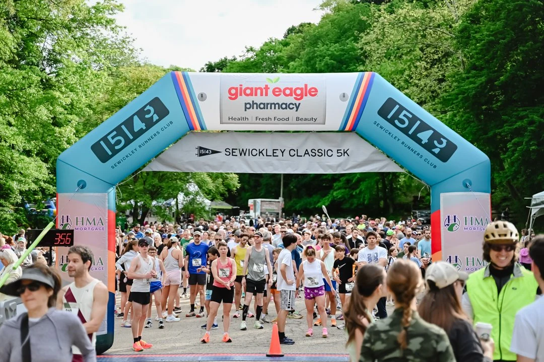 2026 Sewickley Classic start line packed with runners beneath the event arch