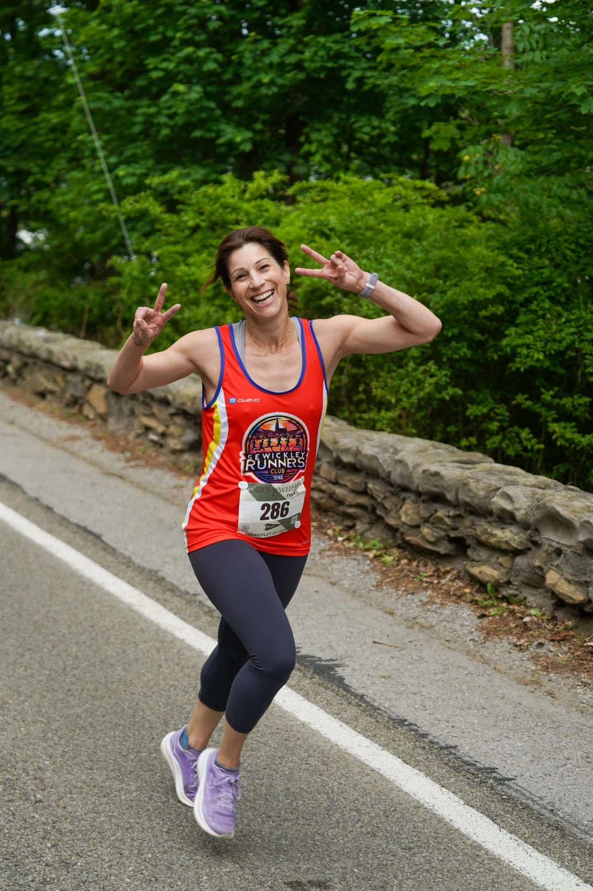 A smiling runner on the Sewickley Classic course