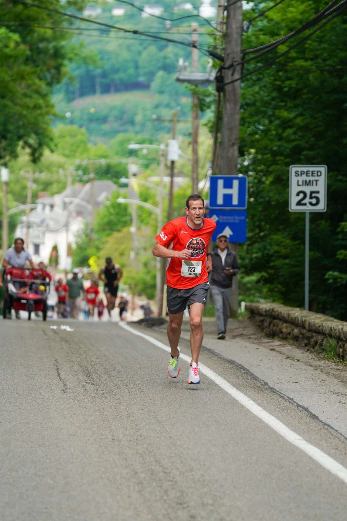 Runner climbing the Sewickley Classic course